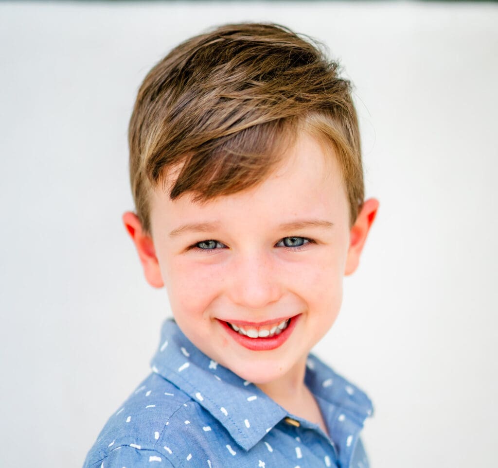 Young boy with simple natural hairstyle photographed for a fine art school portrait by Murfreesboro photographer S. Reed Photography.