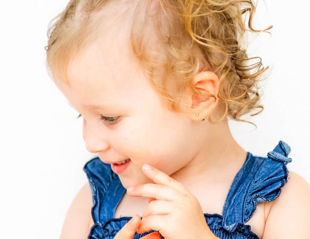 Child with natural curly hair photographed for a fine art school portrait by Murfreesboro school photographer S. Reed Photography.
