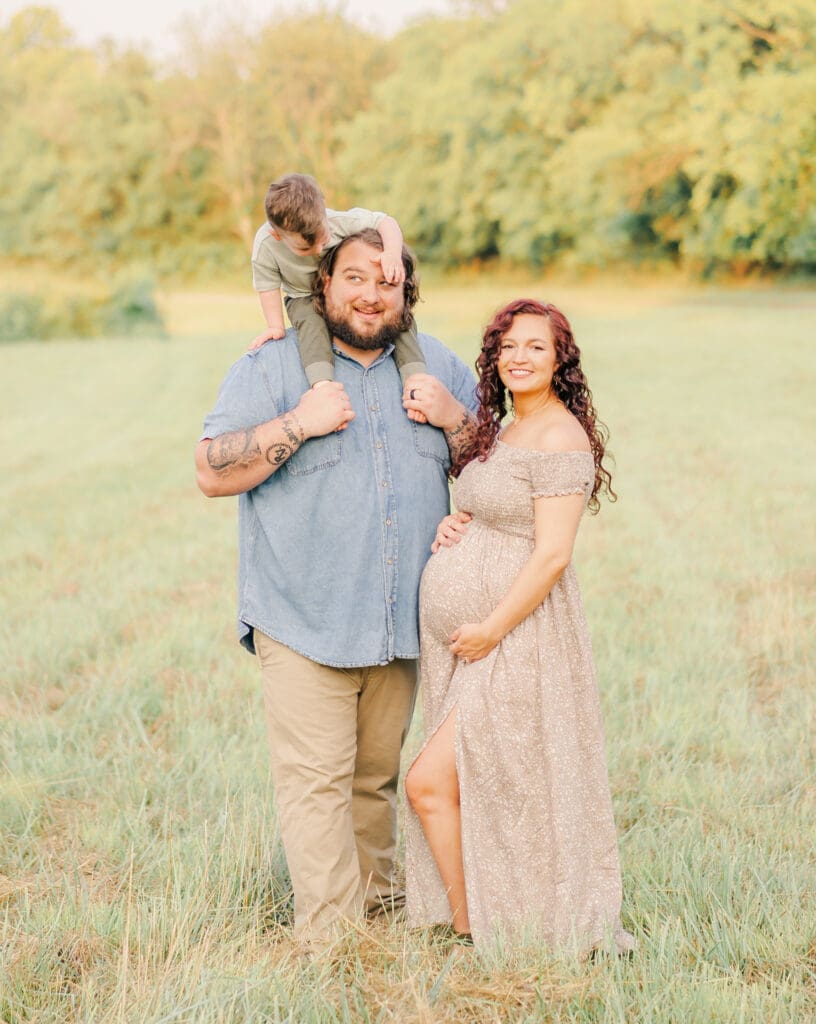 Family maternity portrait with father holding toddler on his shoulders in Murfreesboro Tennessee