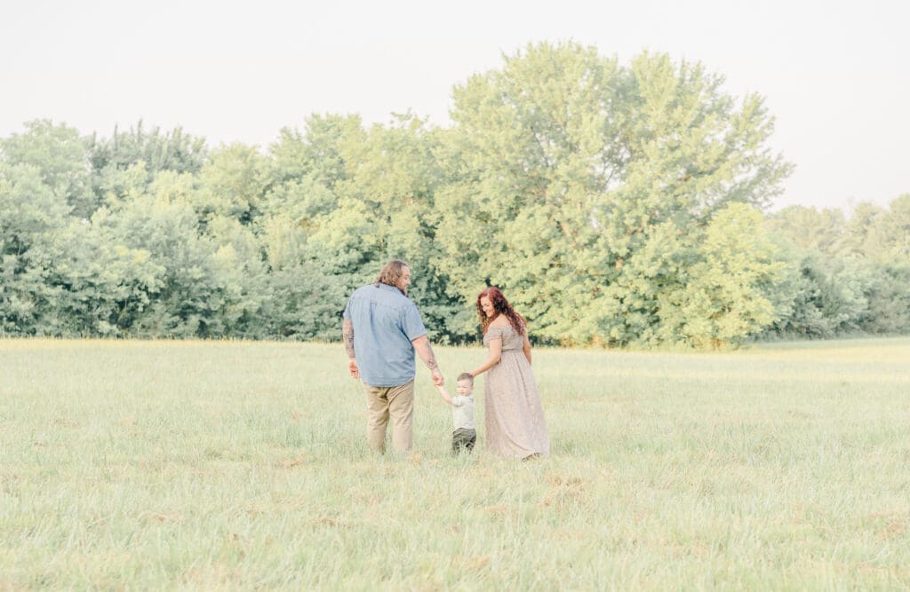 Family walking together during a Murfreesboro Tennessee maternity and family photography session