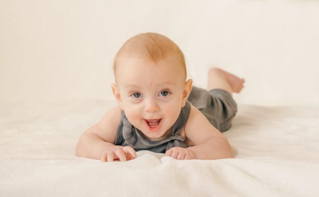 Baby with joyful expression photographed for a natural style child portrait in Middle Tennessee by S. Reed Photography.